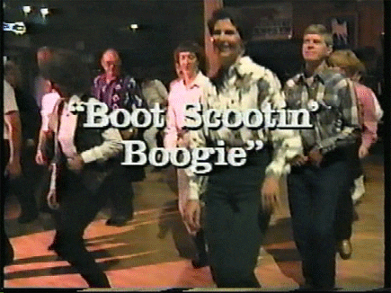 A grainy retro music video still of a line dance in a honky-tonk, dancers in plaid shirts stepping in unison, with the title 'Boot Scootin' Boogie' overlaid in white script.