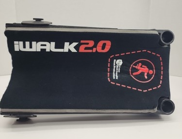 The black cushioned knee platform of an iWalk 2.0 hands-free crutch, photographed on a white background, with the red 'iWALK 2.0' logo across the padded top.