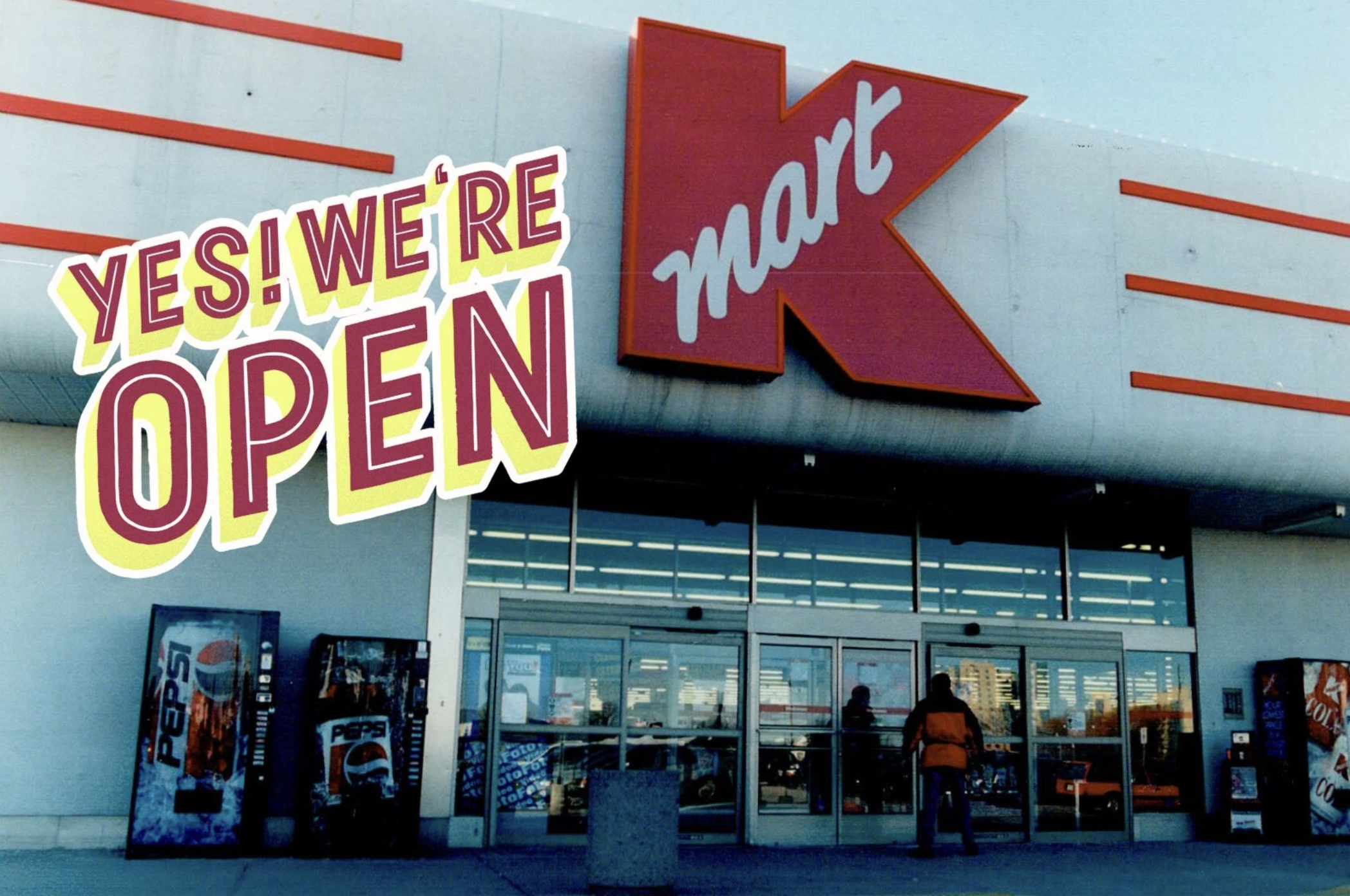 Vintage K-Mart storefront sign in its classic red script logo.