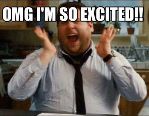 A reaction meme: a man in a shirt and loosened tie in a kitchen, hands raised and mouth open in pure delight, under bold white all-caps text reading 'OMG I'M SO EXCITED!!'
